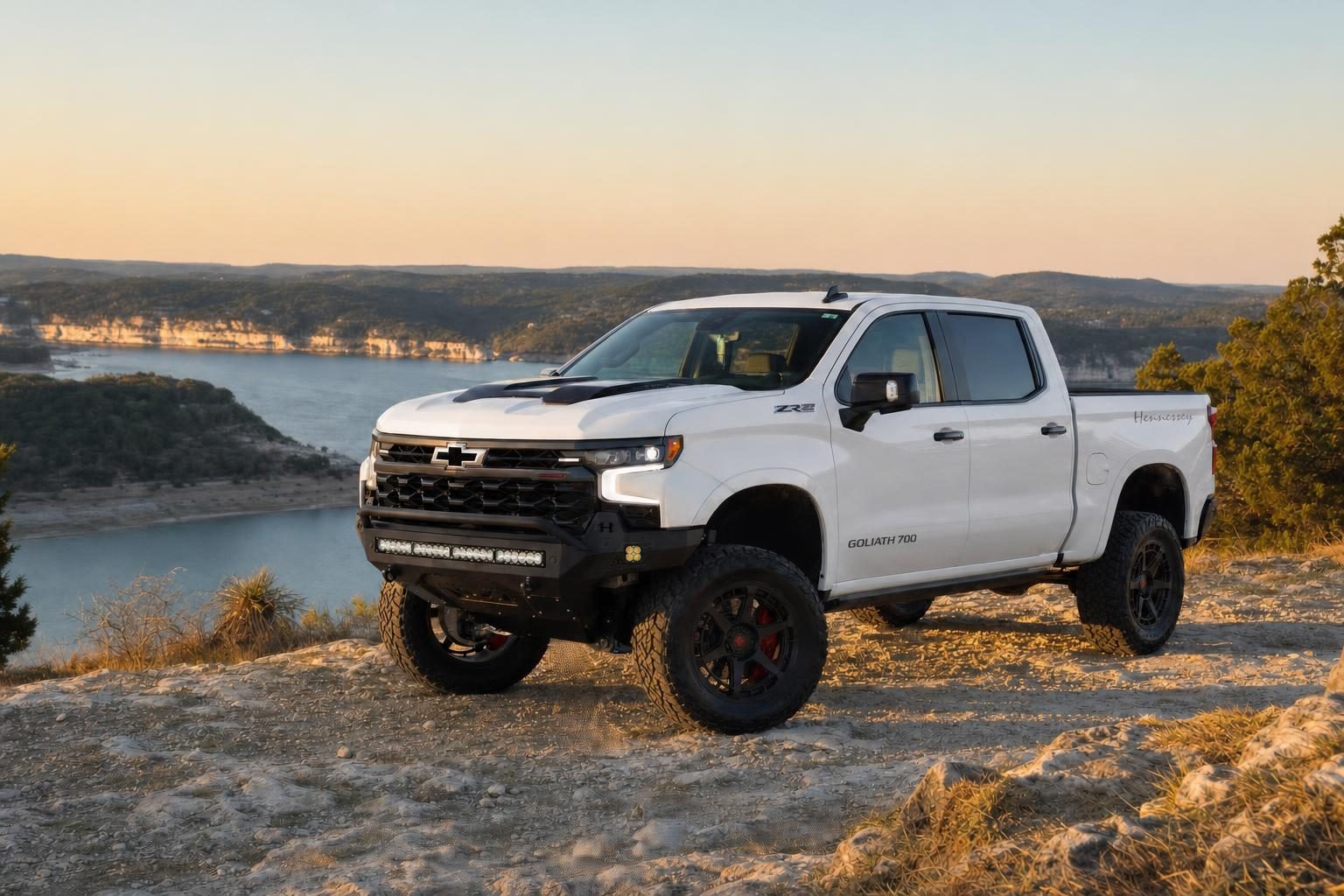 Summit White Hennessey Goliath 700 supercharged Chevrolet Silverado ZR2 on a limestone overlook above Lake Travis near Austin, Texas