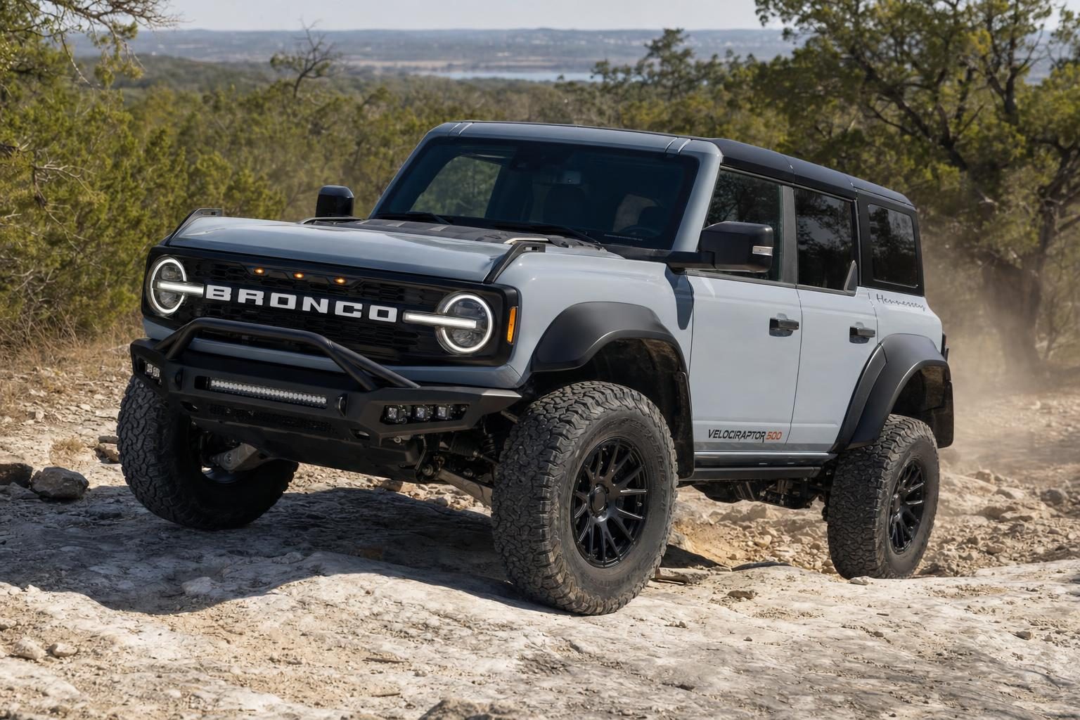 Azure Gray Hennessey Bronco VelociRaptor 500 climbing a limestone trail in the Texas Hill Country near Marble Falls
