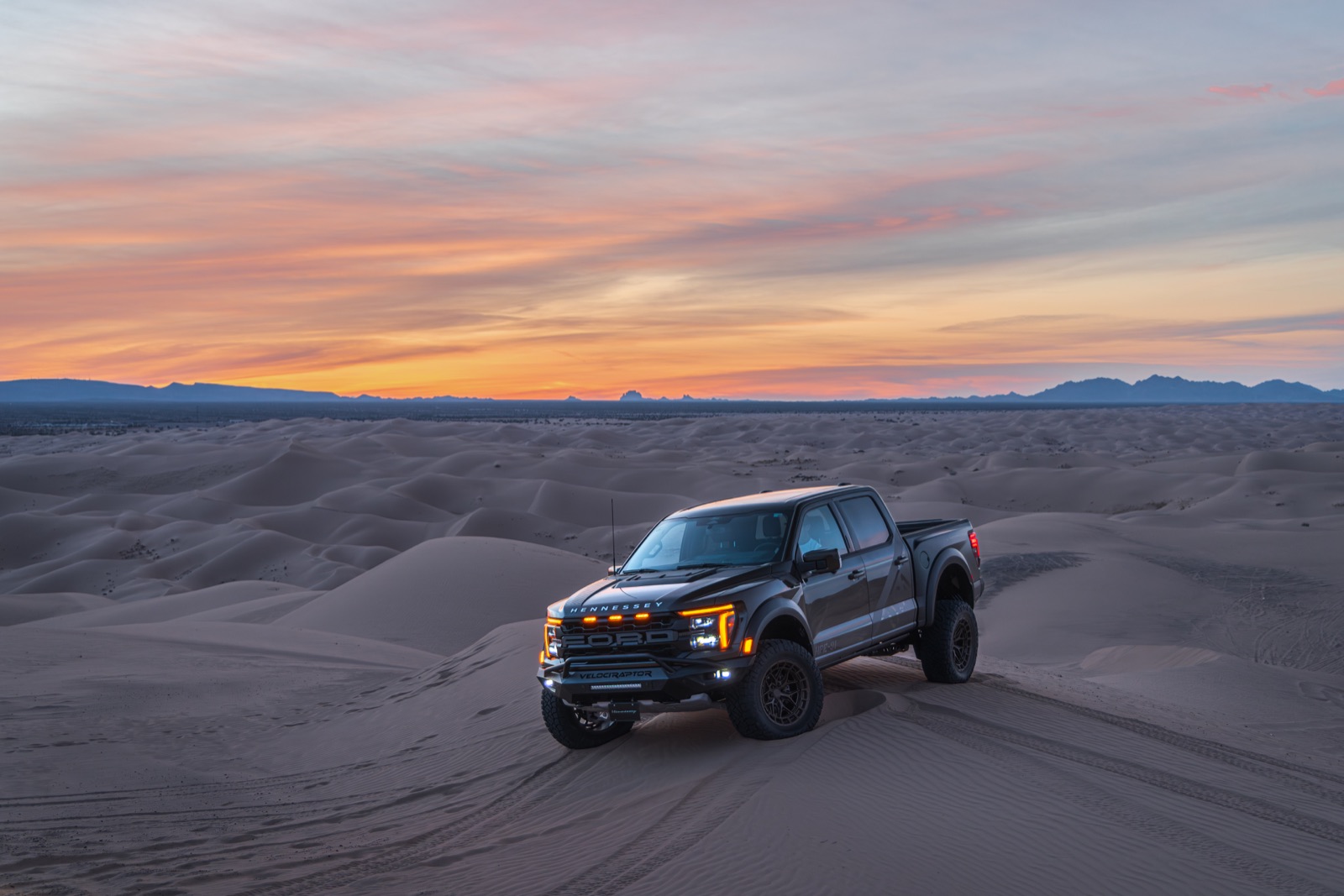 Hennessey VelociRaptor 600 Ford F-150 Raptor driving through desert dunes