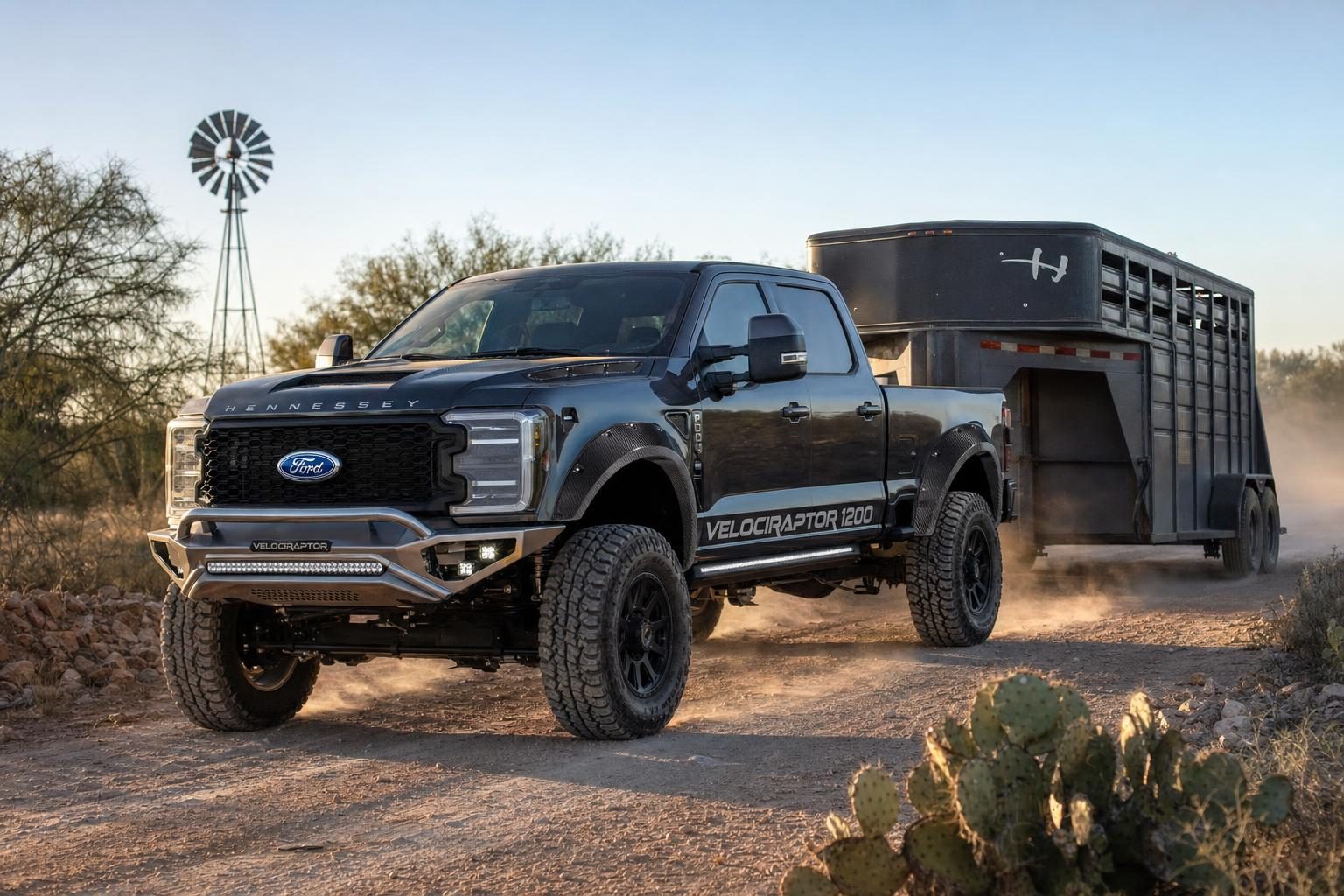 Carbonized Gray Hennessey VelociRaptor 1200 Ford F-250 Super Duty towing a livestock trailer on a South Texas ranch road near Uvalde