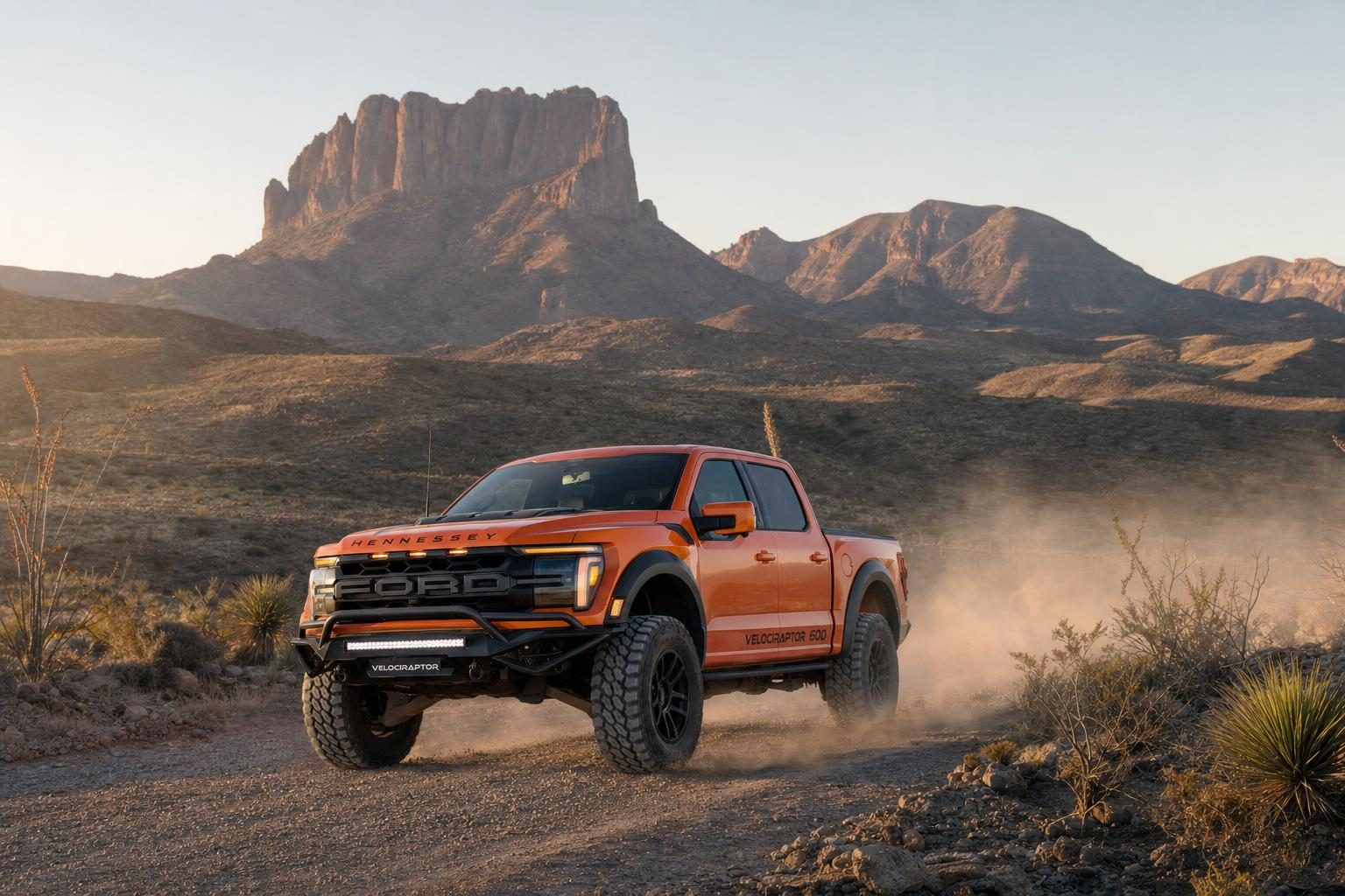 Code Orange Hennessey VelociRaptor 600 Ford F-150 Raptor on a desert road below the Chisos Mountains in Big Bend National Park
