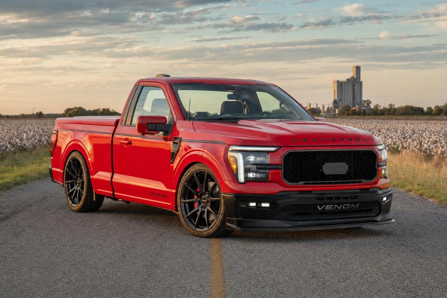 Red Hennessey Venom 800 Lowered Sport Ford F-150 single cab on a farm road near Hutto, Texas with a cotton field and grain elevator